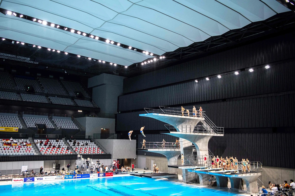 Athletes warm up before the FINA Diving World Cup, which doubles as a test event for the 2020 Tokyo Olympics, at the Tokyo Aquatics Center on May 1, 2021. (AFP / Charly Triballeau)