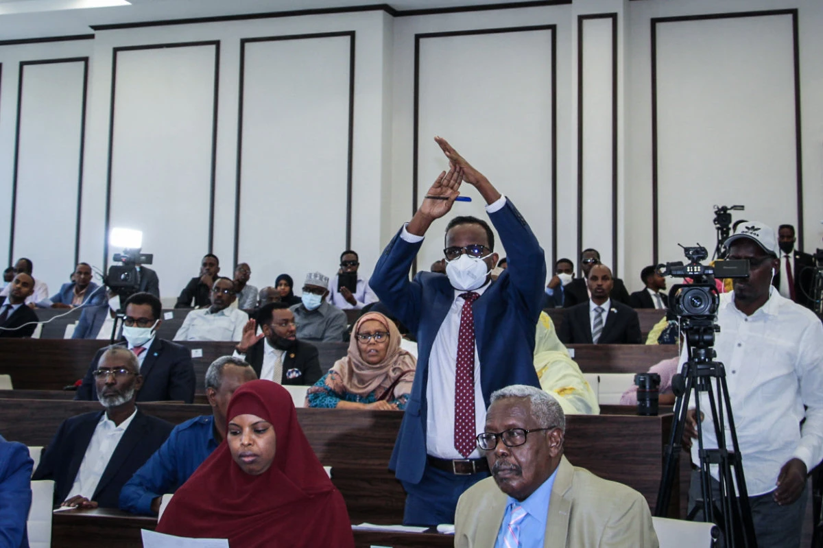 A Somali member of Parliament gestures as the special assembly voted on on May 1, 2021 to abandon the two-year extension of President Mohamed Abdullahi Mohamed's term. (AFP)