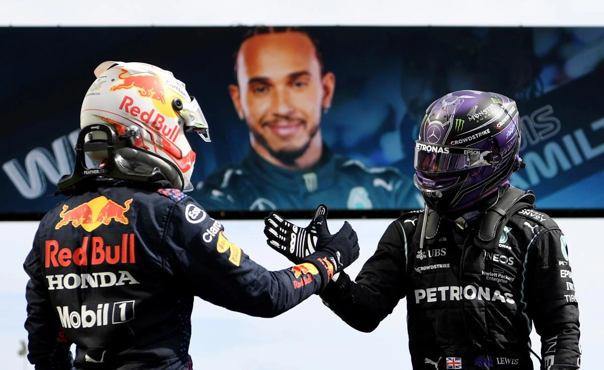 Lewis Hamilton shakes hands with Red Bull's Max Verstappen after winning the Portuguese Grand Prix. (Reuters)