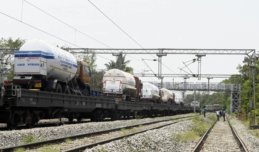 Oxygen tankers are seen on a special train 'Oxygen Express' upon their arrival at a station amidst rising Covid-19 coronavirus cases, in Hyderabad on May 2, 2021. (AFP)