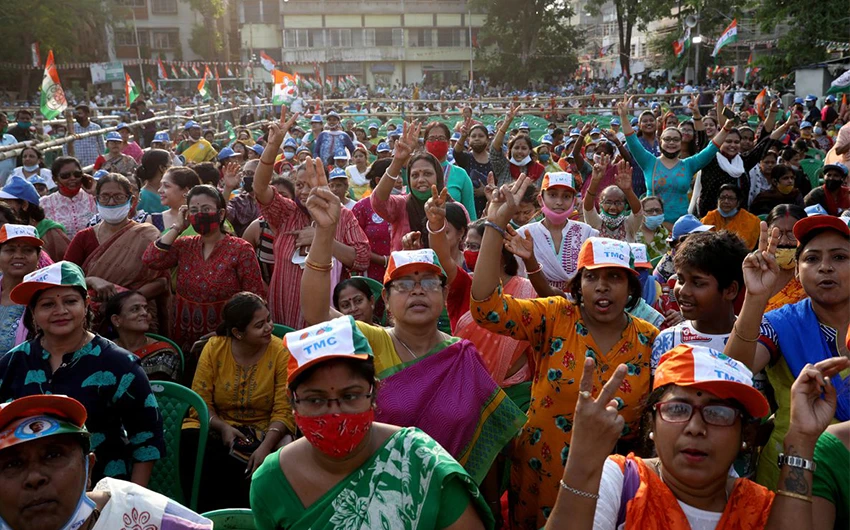 Supporters of Chief Minister of West Bengal state and the Chief of Trinamool Congress Mamata Banerjee celebrate after the initial poll results, amidst the spread of the coronavirus disease in Kolkata, India, on May 2, 2021. (REUTERS)