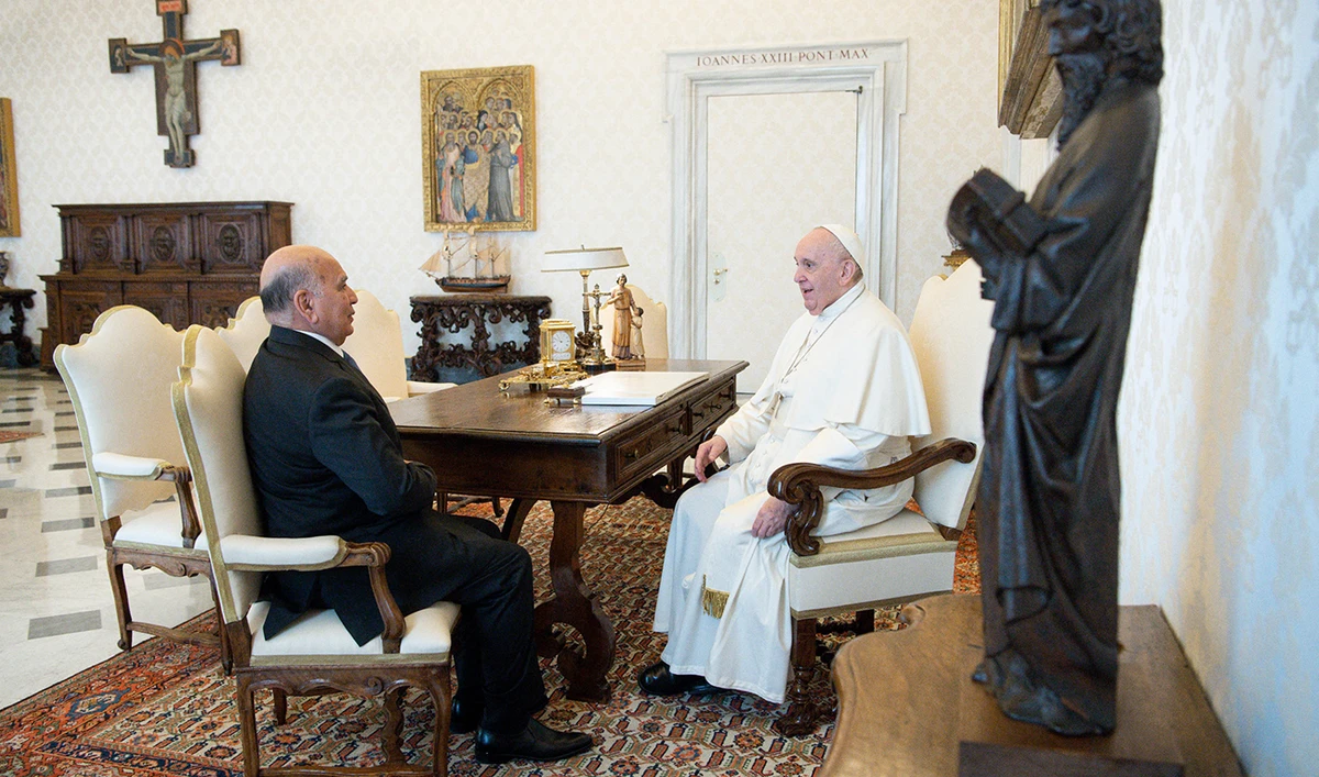 Pope Francis (R) during the private audience with Fuad Hussein Minister of Foreign Affairs of Iraq at the Vatican. (AFP)