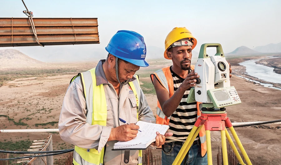 Workers perform measurements at the Grand Ethiopian Renaissance Dam in Ethiopia. Egypt, Sudan and Ethiopia are deadlocked in the dam dispute. (File/AFP)