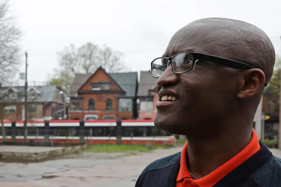 Apollinaire Nduwimana, a Burundian asylum-seeker awaiting a refugee application, poses outside a school near his lodging in Toronto. (REUTERS)