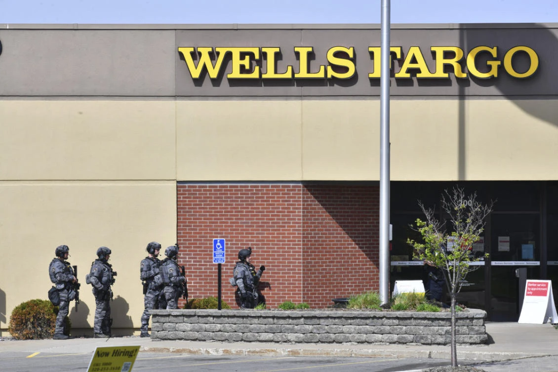 SWAT team officers respond to the scene of a reported hostage situation at the Wells Fargo branch TMay 6, 2021, in south St. Cloud, Minnesota, where a bank robbery with hostages was reported. (Dave Schwarz/St. Cloud Times via AP)