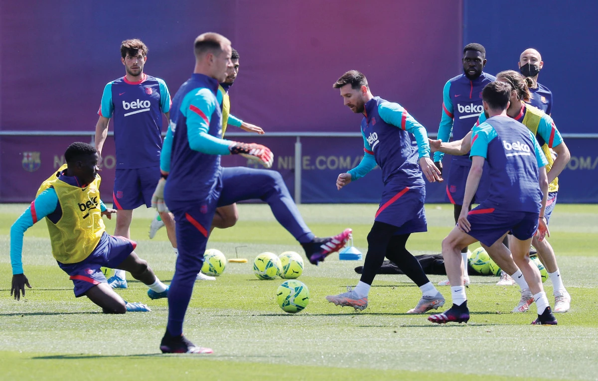 Barcelona’s Lionel Messi and teammates during training ahead of their crucial La Liga match against frontrunners Atletico Madrid on Saturday. Reuters