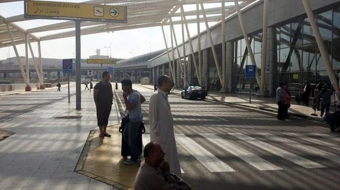 People wait outside the international arrivals terminal at Cairo Airport, Egypt. (Reuters)