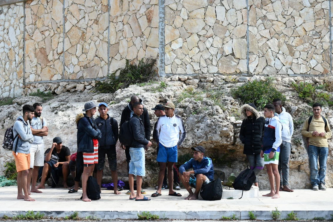 Migrants are seen after disembarking from a wooden boat on the island of Lampedusa, Italy, October 18, 2019. (Reuters)