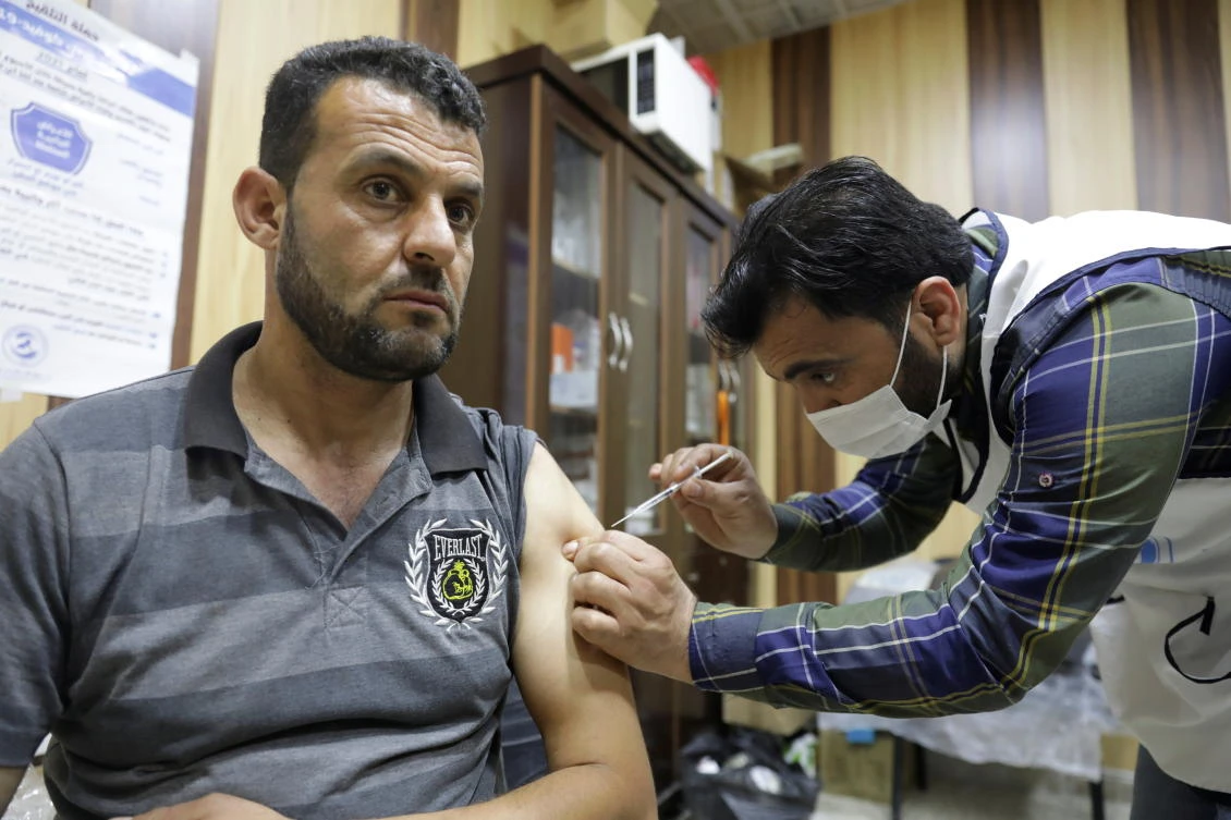 A man receives a dose of COVID-19 vaccine at Ibn Sina medical center in rebel-held Idlib city, Syria. (REUTERS)