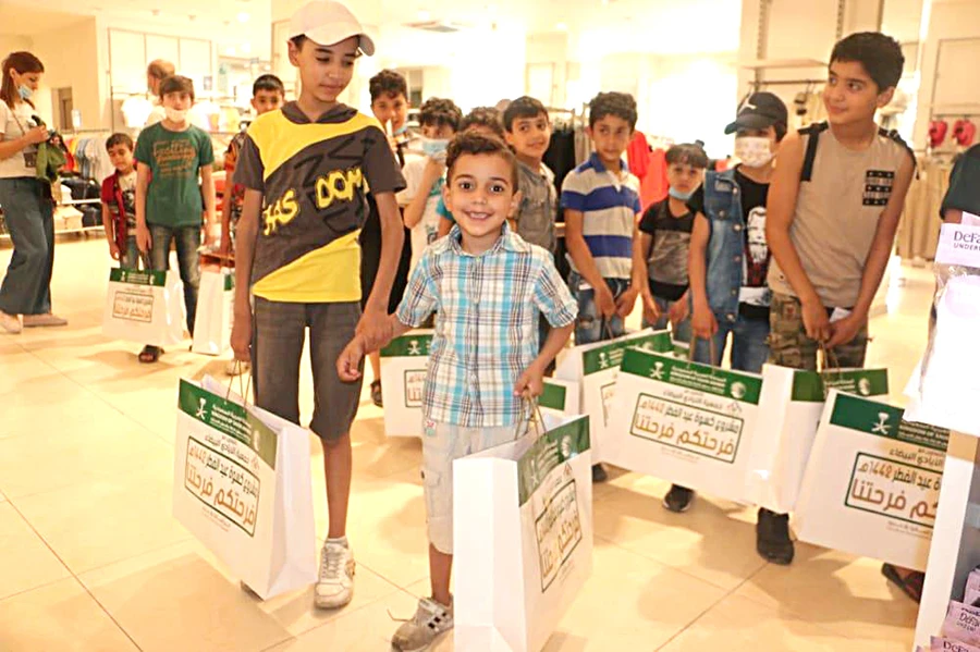 A young boy beams with joy on receiving Eid Al-Fitr clothes distributed by the King Salman Humanitarian Aid and Relief Center (KSrelief) among orphans of Syrian and Palestinian refugees in Beirut. (SPA)