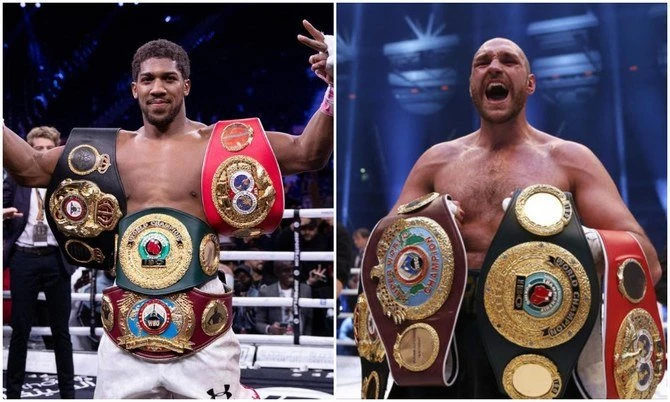 The all-British fight between Anthony Joshua (L) and Tyson Fury for the undisputed world heavyweight title will take place in Saudi Arabia, Fury announced. (AFP/File Photos)