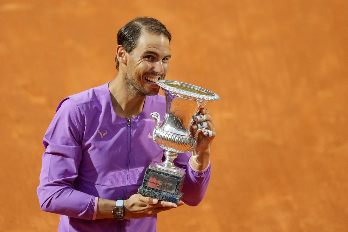 Spain's Rafael Nadal celebrates with the trophy after winning the Italian Open tennis tournament in Rome on May 16, 2021. (AP Photo/Gregorio Borgia)