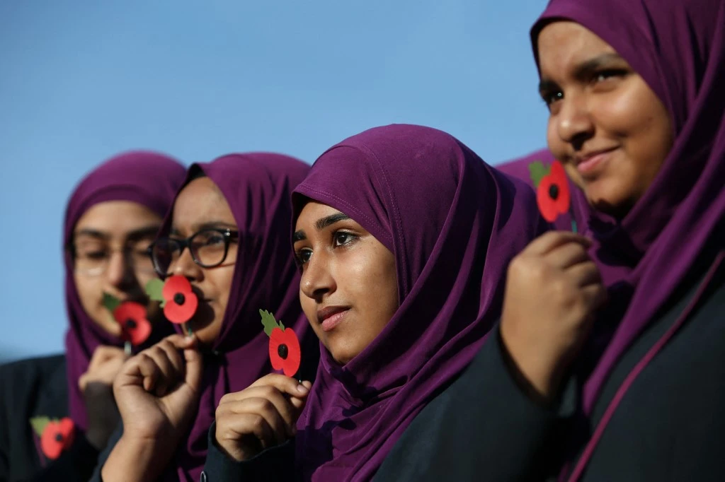 Girlguiding, the UK’s largest girl-only youth organization, discovered instances of Islamophobia, a Muslim girl being asked to remove her hijab during a trip. (AFP file photo)