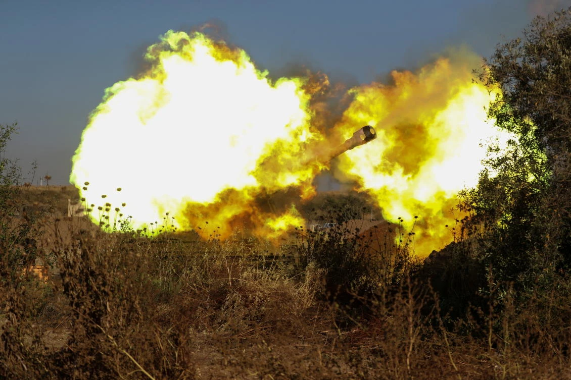 An artillery unit fires near the border between Israel and the Gaza strip, on the Israeli side May 19, 2021. (Reuters)