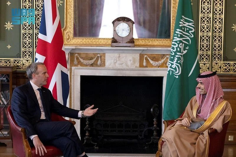 Prince Faisal bin Farhan meets with Dominic Raab in London on Wednesday. (SPA)