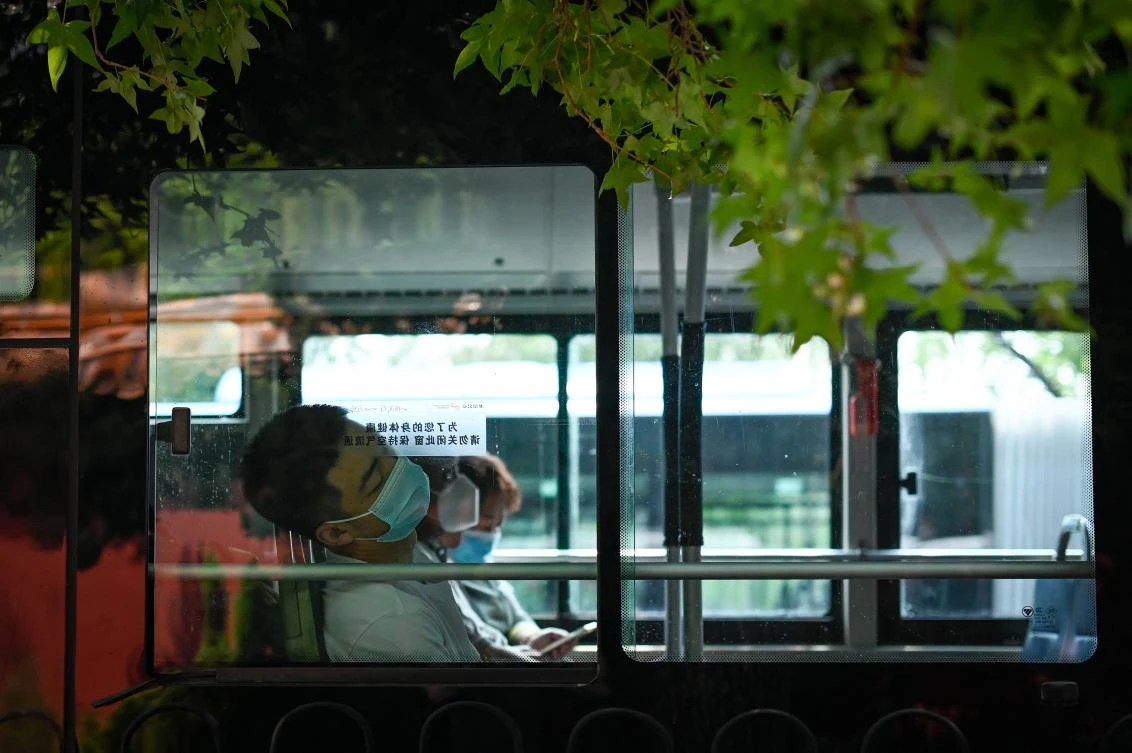 A man takes a rest while traveling on a bus in Beijing. China looked to Saudi Araba to provide the lion's share of its oil imports last year. (AFP)