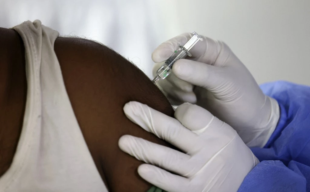 The UAE ranks high globally for COVID-19 testing and vaccination rates. (AFP)