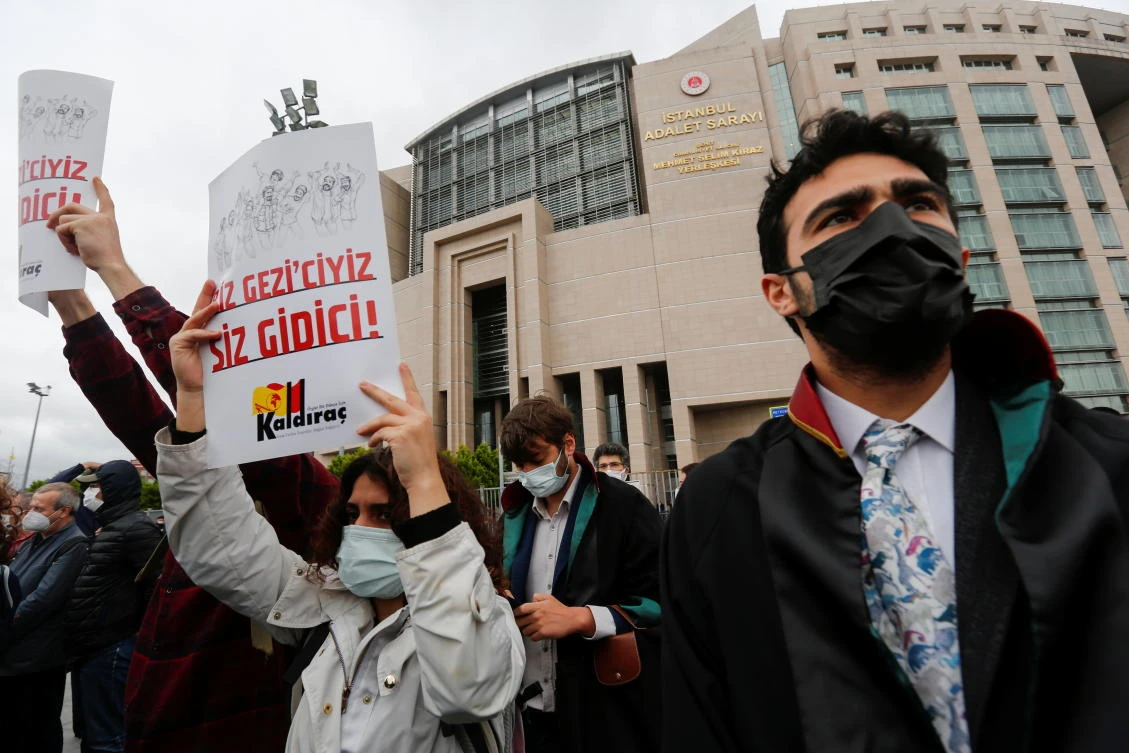 Lawyers and supporters of the Gezi solidarity group gather in front of the Caglayan Courthouse, as a Turkish court began the re-trial of philanthropist Osman Kavala and 15 others. (Reuters)