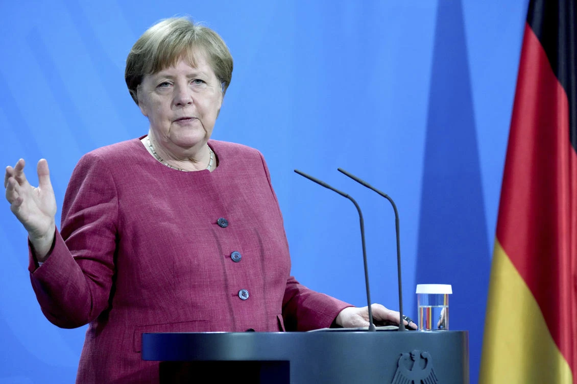 Germany lifts more restrictions, Merkel urges caution