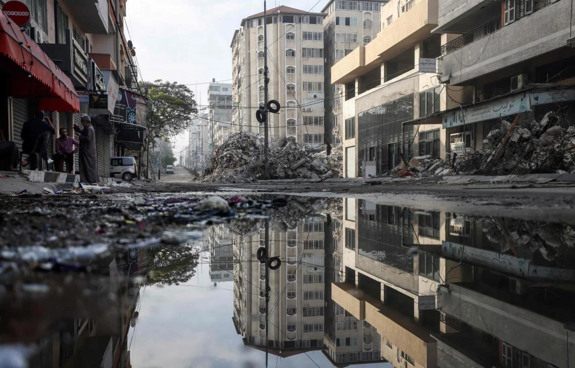 A picture shows a street in Gaza City's Rimal area that was bombed by an Israeli air strike. (File/AFP)