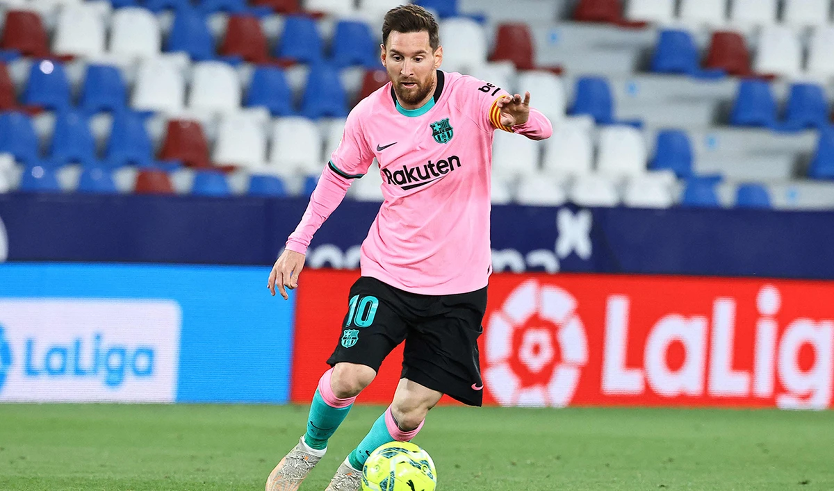 Barcelona's Lionel Messi controls the ball during the Spanish league football match Levante UD against FC Barcelona at the Ciutat de Valencia stadium in Valencia on May 11, 2021. (AFP)