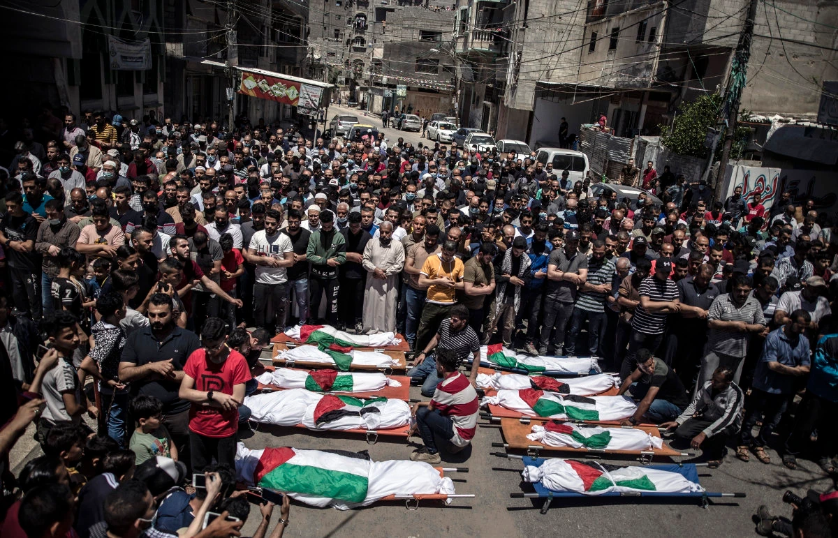 Palestinians attend the funeral of two women and eight children of the Abu Hatab family, who were killed after an Israeli air strike on May 15, 2021 in Gaza City. (AP file photo)
