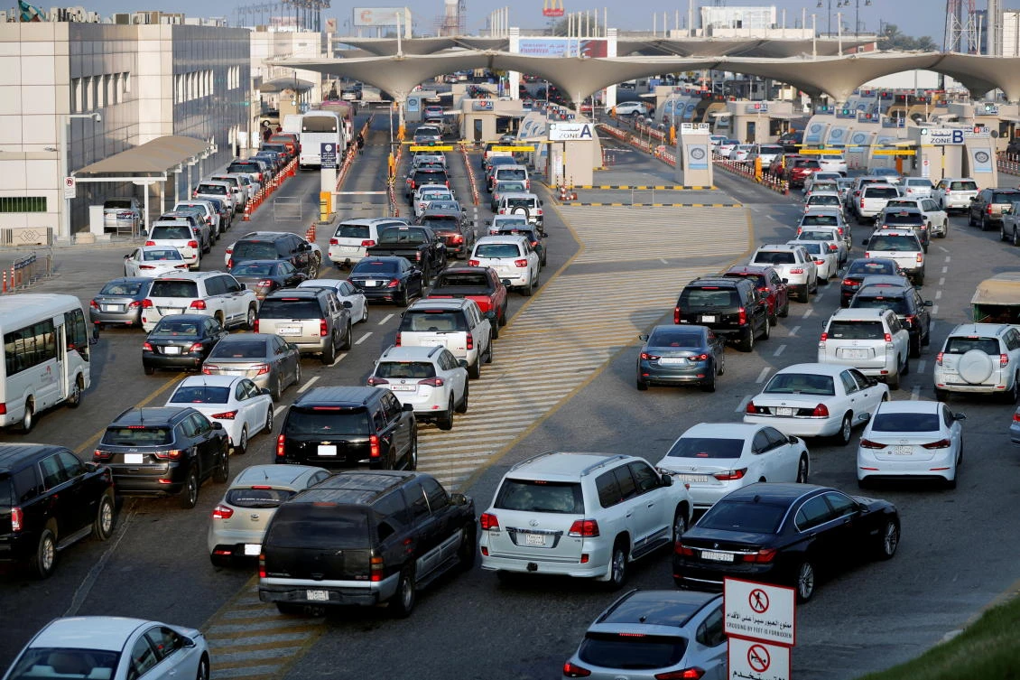 Saudi cars line up during rush hour on the King Fahd Causeway, a bridge connecting Saudi Arabia and Bahrain. Fuel retailers in the Kingdom are benefiting from rising demand as travel restrictions are eased. (Reuters)