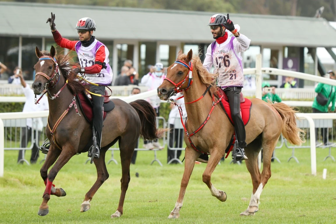 Emirati riders Salem Al-Ketbi and Mansour Al-Farsi celebrate their 1-2 finish at the Longines FEI Endurance World Championship 2021. (WAM)