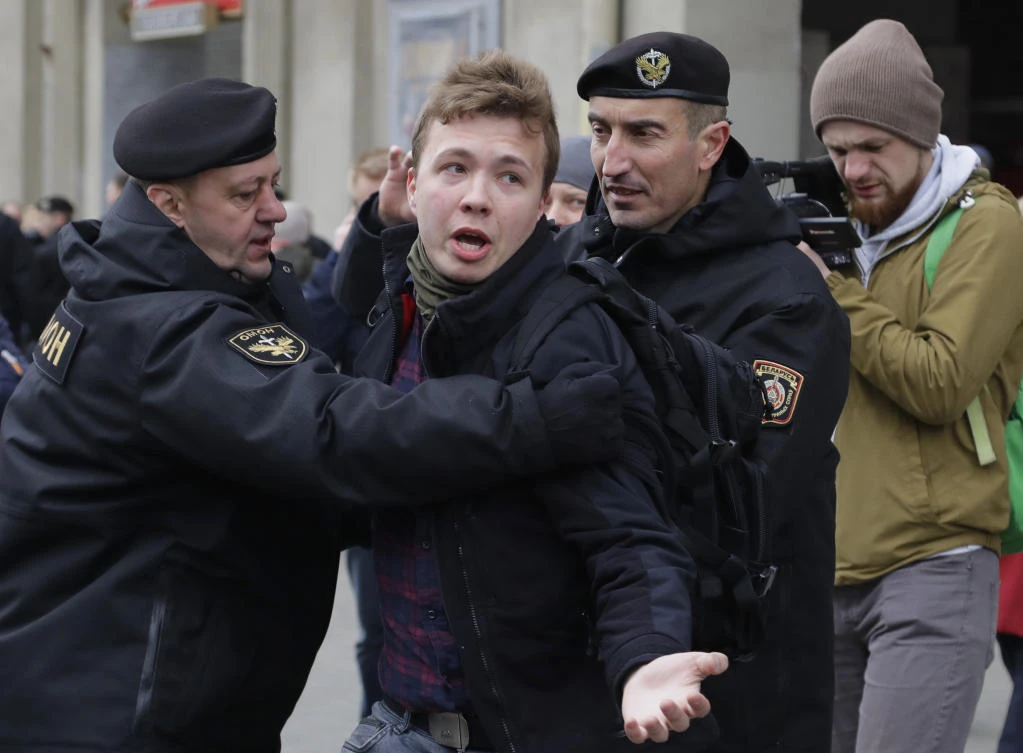 Belarus police detain journalist Raman Pratasevich, center, in Minsk, Belarus in this March 26, 2017 file photo. (AP)