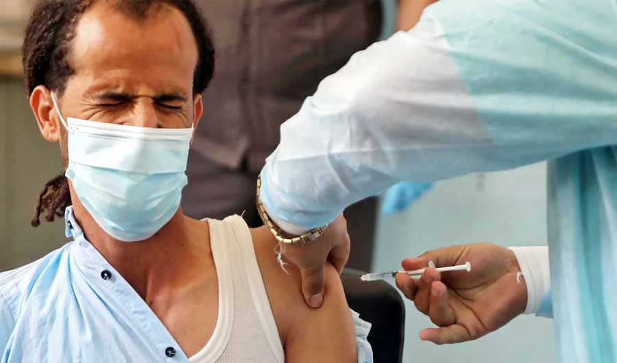 A Yemeni health worker receives a dose of the AstraZeneca COVID-19 vaccine at a vaccination centre in Yemen's third city of Taez, on April 21, 2021. (AFP)