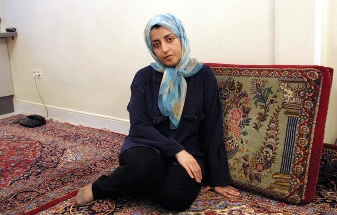 Iranian rights activist and journalist Narges Mohammadi has been handed a new sentence of 80 lashes and 30 months in jail, her lawyer said Thursday. (AFP)