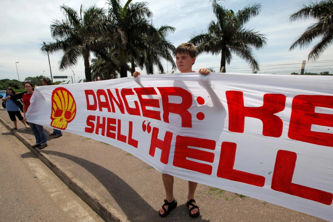 Members of the Indigenous Environmental Network demonstrate against the Shell oil company outside the South African Petroleum Refinery (SAPREF) in Durban. (Reuters)