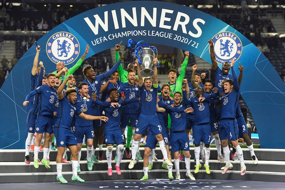 Chelsea's team captain Cesar Azpilicueta lifts the trophy at the end of the Champions League final soccer match between Manchester City and Chelsea at the Dragao Stadium in Porto, Portugal, Saturday, May 29, 2021. (AP)