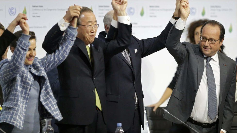 UN Secretary-General Ban Ki-moon and French President Francois Hollande after consensus is reached at COP 21, Paris, 2015. (Reuters)