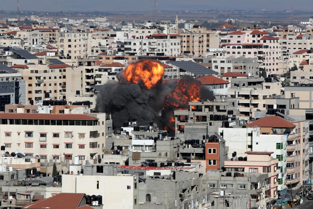 Smoke and flames rise during an Israeli air strike on Gaza City, May 14, 2021. (Reuters)
