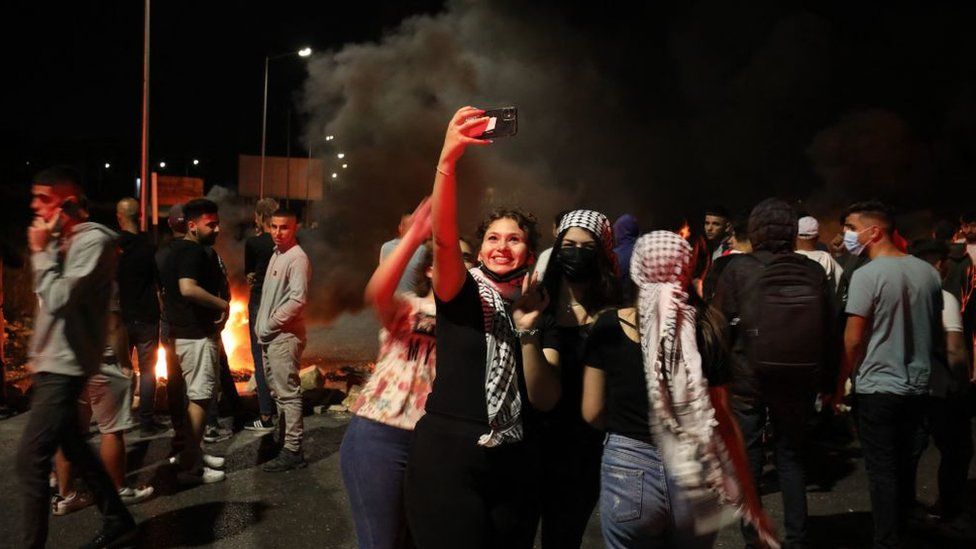 Young Palestinians and Israelis captured the recent conflict and surrounding events on their smartphones. (Getty Images)