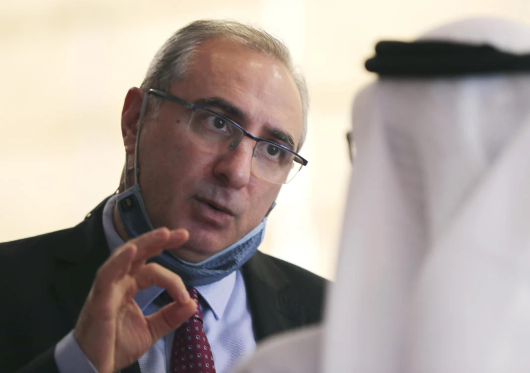 Israel's ambassador to the UAE, Eitan Na'eh talks with an Emirati official during the Global Investment Forum in Dubai. (AP)