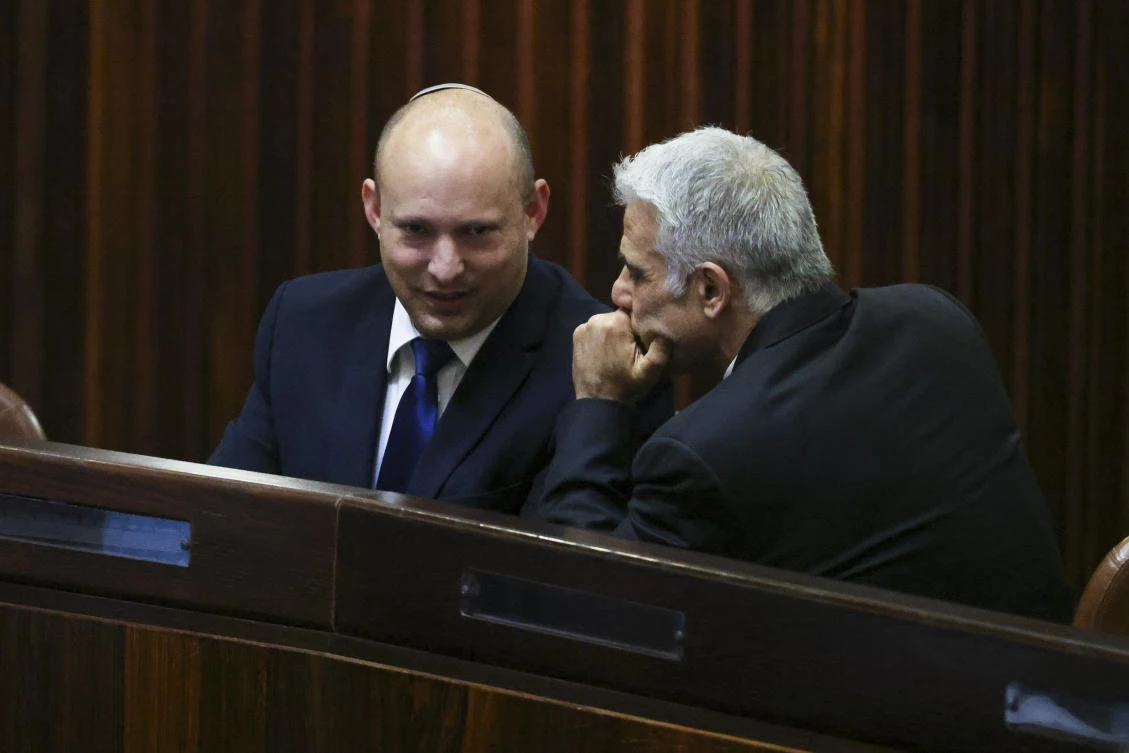 Yamina party leader Naftali Bennett, left, and Yesh Atid party leader Yair Lapid in the Knesset, Jerusalem, June 2, 2021. (AP Photo)