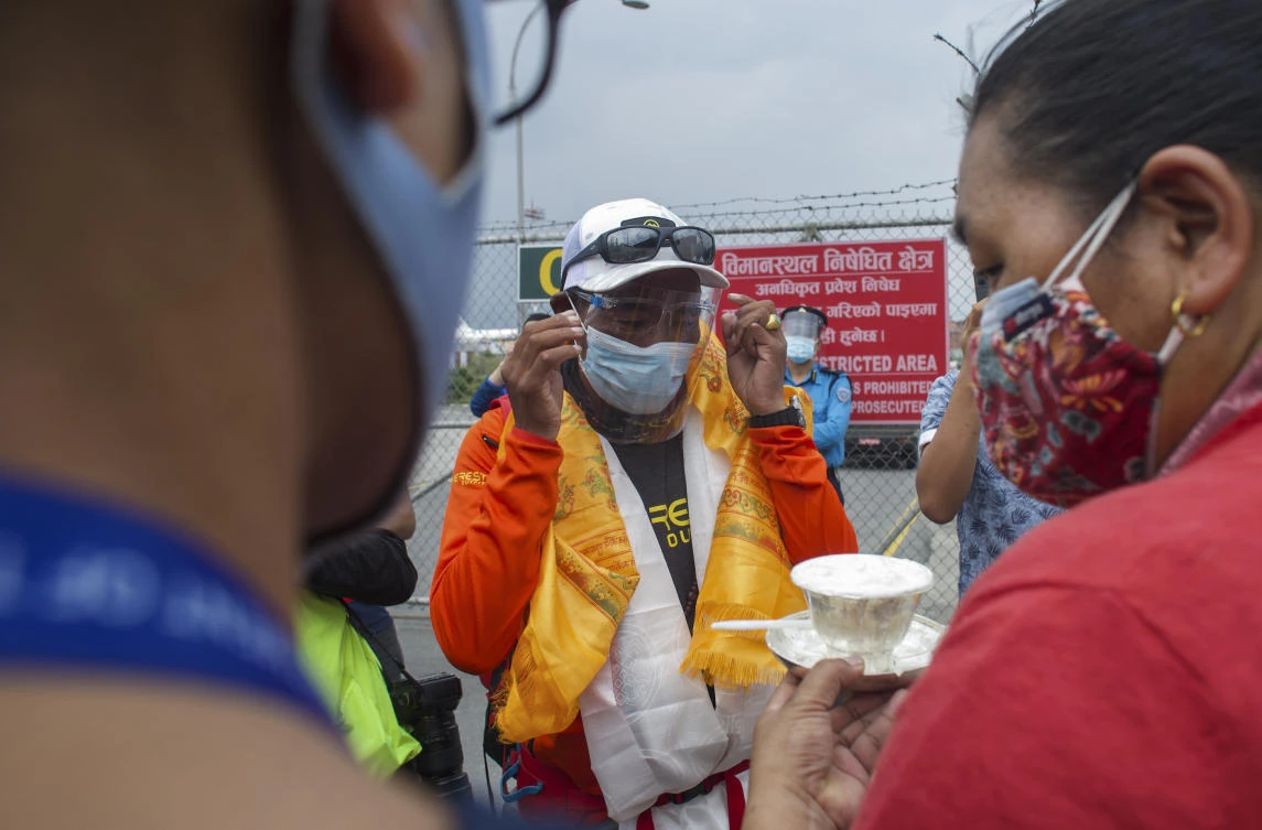 Everest climbers struggle to return home amid Nepal COVID-19 travel curbs