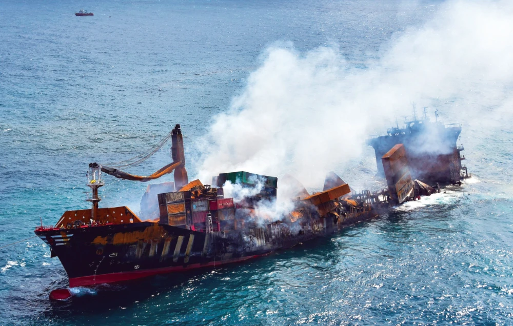 A photo handout shows the sinking MV X-Press Pearl at Kapungoda where it is anchored off Colombo port on Wednesday. (Sri Lanka Air Force via AP)