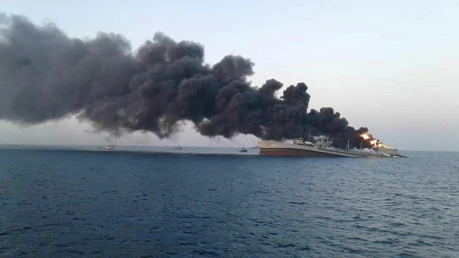 Smoke rises from Iran navy’s largest ship in Jask port in the Gulf, Iran, June 2, 2021. WANA (West Asia News Agency) via Reuters