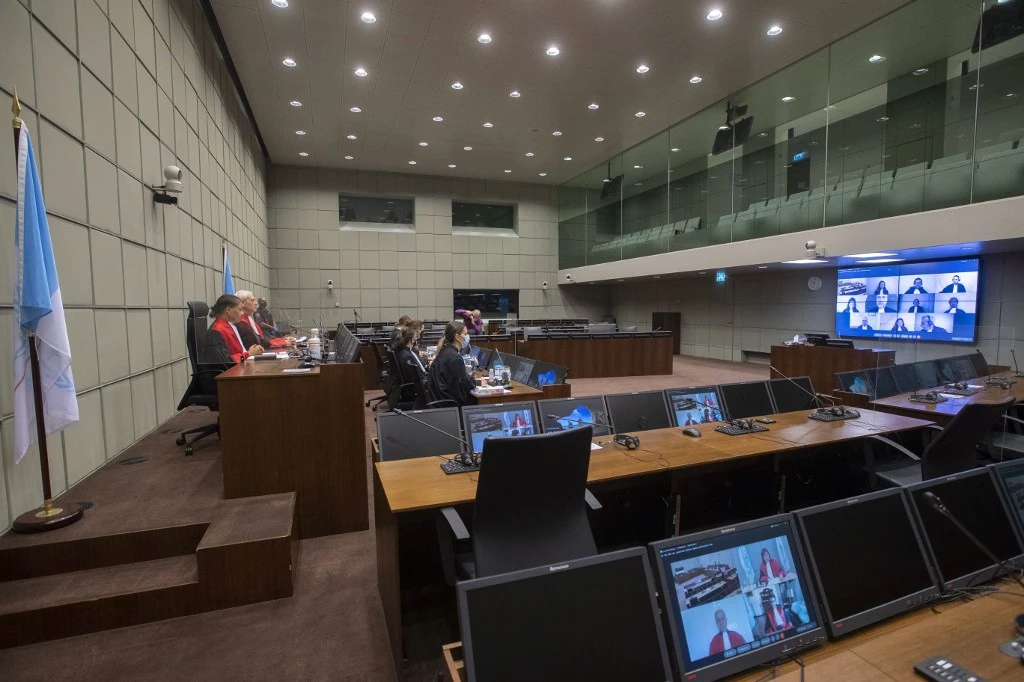 Judges David Re (2ndL) and Janet Nosworthy (L) are seen before the start of the session of the Lebanon Tribunal in Leidschendam, on Dec. 11, 2020. (File/AFP)