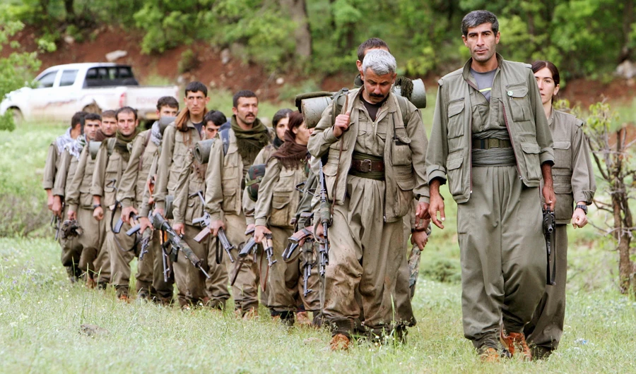 In this May 14, 2013 file photo, a group of armed Kurdish fighters from the Kurdistan Workers Party (PKK) enter northern Iraq in the Heror area, northeast of Dahuk, northwest of Baghdad, Iraq. (AP)