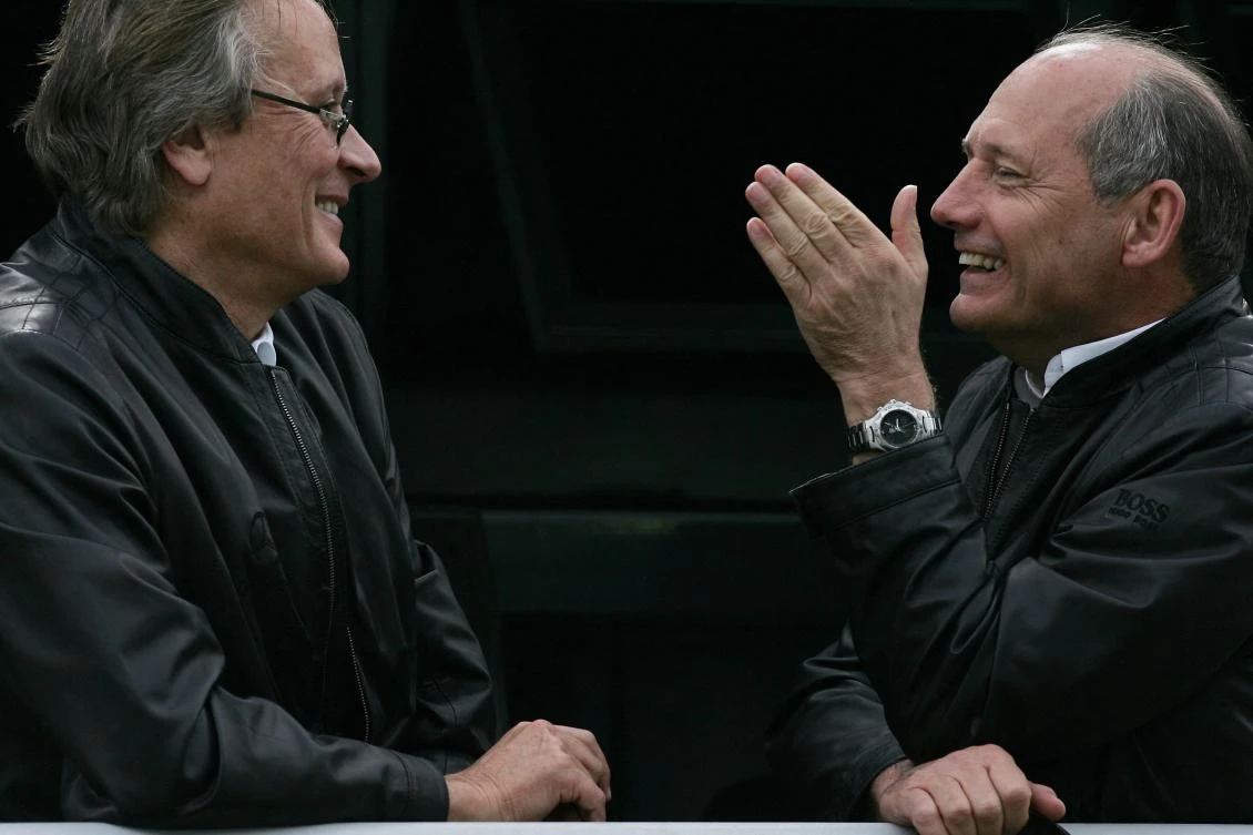 McLaren chairman Ron Dennis (R) chats with co-owner of the McLaren group Mansour Ojjeh (L) in the paddock of the Interlagos racetrack in Sao Paulo in 2006. (AFP)