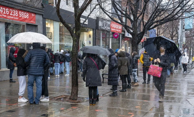 People gathered outside in Toronto. A vehicle struck a family of five and targeted them because they were Muslims, in London, Ontario, police said Monday. (AP)