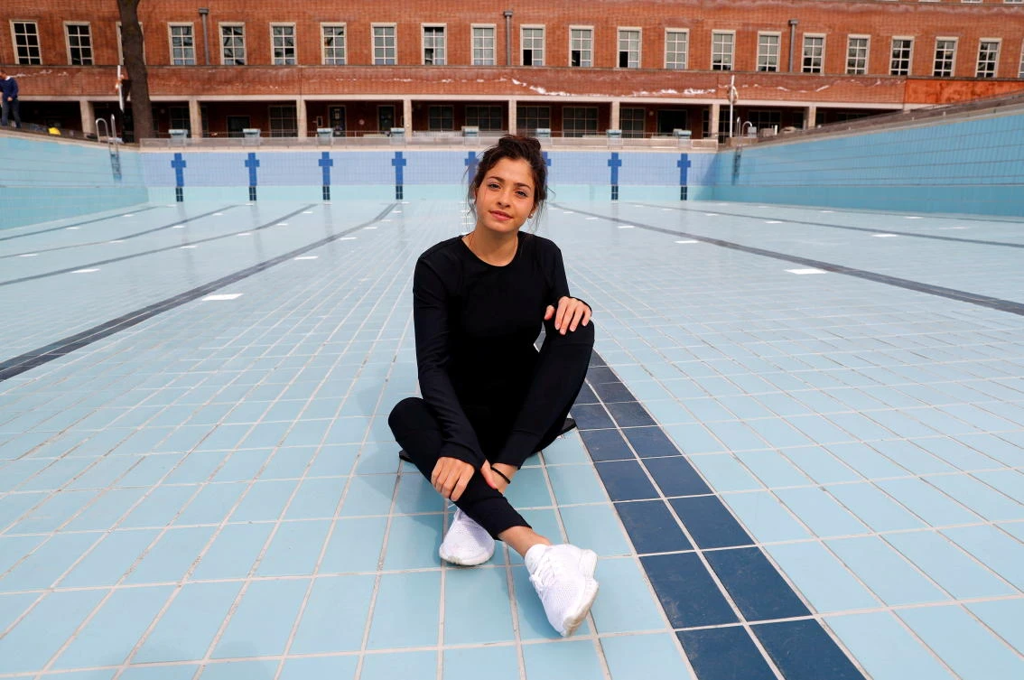 Syrian refugee and Olympic swimmer Yusra Mardini poses at the Olympic park in Berlin, Germany in 2018. IOC named a refugee team of 29 athletes for Tokyo Olympics to compete in 12 sports.(Reuters)