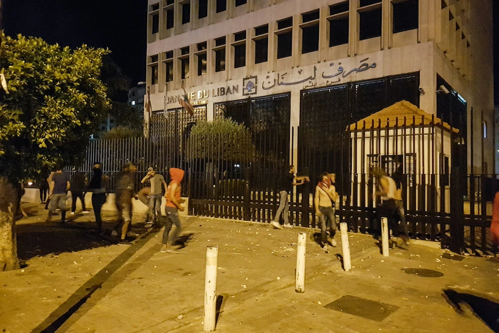 Lebanon grants limited access to bank deposits amid crisis