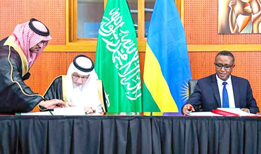 Minister of State for African Affairs Ahmed bin Abdul Aziz Kattan signs a deal with Rwanda’s Foreign Minister Vincent Perrotta. (SPA)