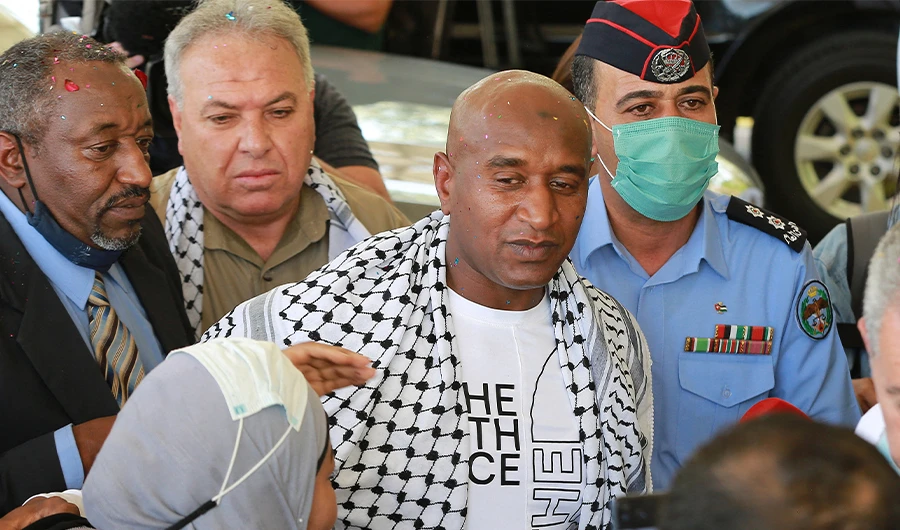 Palestinian-Jordanian Abdullah Abu Jaber, who was jailed in Israel, is welcomed by his family upon his release at the Sheikh Hussein Crossing between Jordan and Israel on June 8, 2021. (AFP)