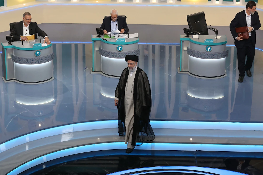Iran’s presidential candidates Alireza Zakani, left, Mohsen Mehralizadeh, center, and Amirhossein Ghazizadeh-Hashemi, right, with Ebrahim Raisi, front, at a TV debate, Tehran, June 8, 2021. (AFP)